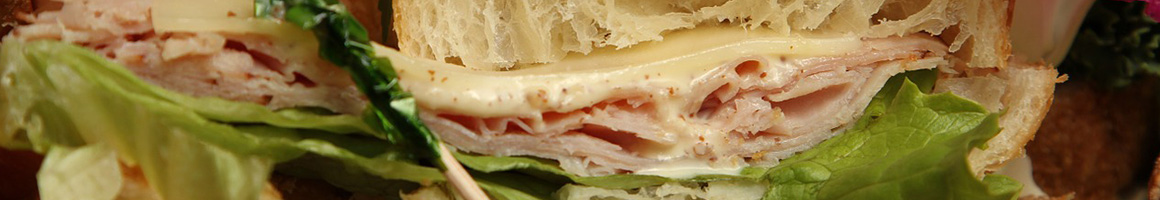 Eating Deli Sandwich at Ray and Mike's Dairy & Deli restaurant in Hamden, CT.
